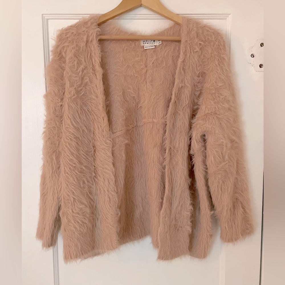 Fuzzy, pink cardigan
